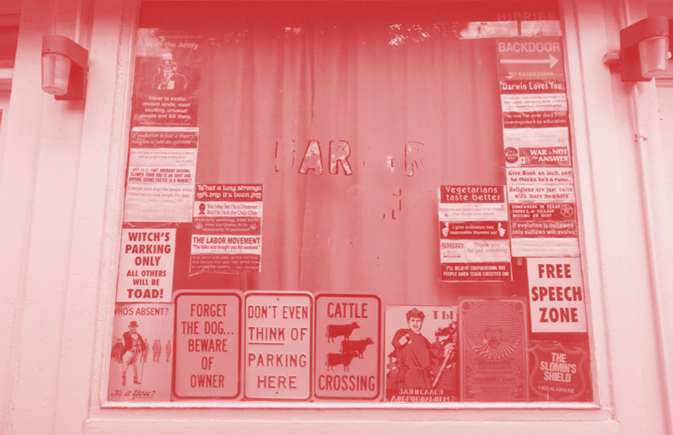Signs in a window in the United States (Dennis Fraevich, cropped and coloured)